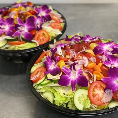Fresh salad trays with orchids