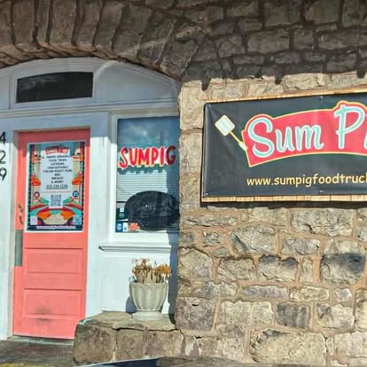 Sum Pig storefront entrance with sign