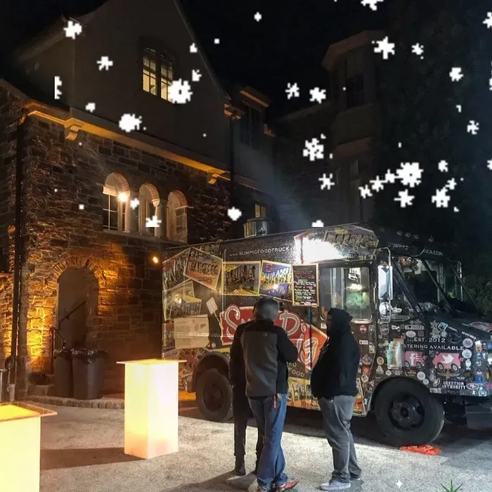 The Sum Pig food truck at an evening event